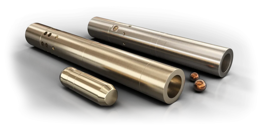 Three cylindrical metal tubes and two small copper components displayed on a black surface.