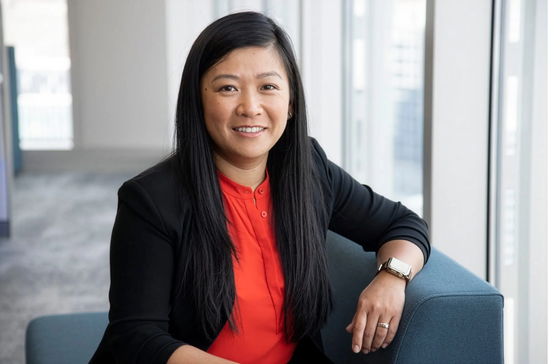 Portrait of Sonya Lau by a window with natural light.